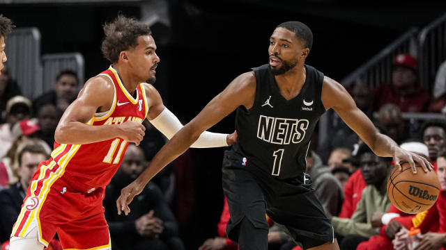 Atlanta Hawks guard Trae Young (11) defends against Brooklyn Nets forward Mikal Bridges (1)